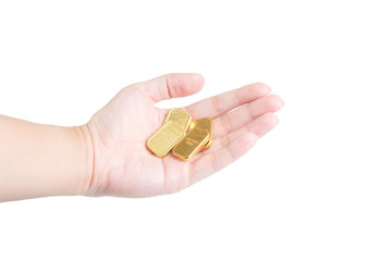 Fototapeta premium The chocolate gold coin in hand on white background, clipping path