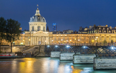 Fototapeta na wymiar The French Academy et pont des Arts at night , Paris, France.
