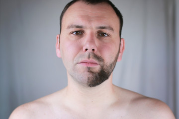 Fototapeta premium bearded man shaving