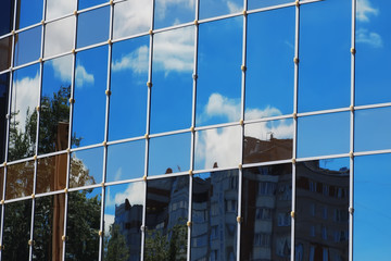 glass office building reflection sky cloud
