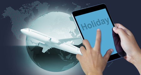 Hand holding the digital tablet