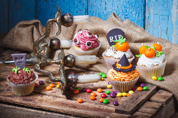 Halloween cupcakes with colored decorations