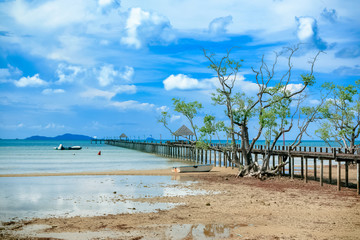 Wooden pier in beautiful beach kho Mak Island, eastern Thailand.