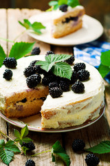 Honey cake with blackberry and whipped cream.