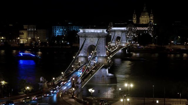 Time lapse of the traffic in the chain bridge in Budapest at night.