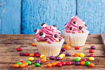 Halloween cupcakes with colored decorations