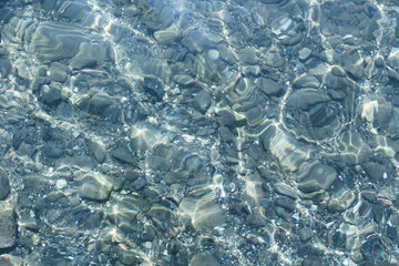 Stones in the clear sea waters. Sea bottom