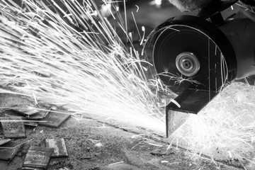 worker cutting metal