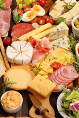 Board of various types of cheese and appetizers set