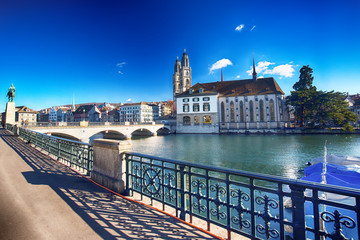 Naklejka premium Grossmünster church and the Limmat river in the old city of Zurich, Switzerland