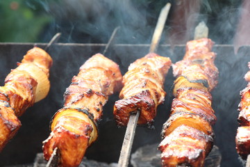 meat is roasted on skewers