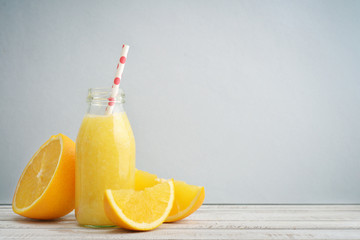 Orange smoothie in retro bottle - obrazy, fototapety, plakaty