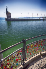 Padlocks in harbor of Konstanz city with a view to lake Constance.  Konstanz is a city located in...