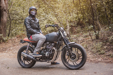 Fototapeta na wymiar Biker man sitting on his motorcycle