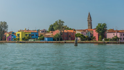 Obraz premium See in foreground ,colorful houses and leaning bell tower in Burano, Italy.