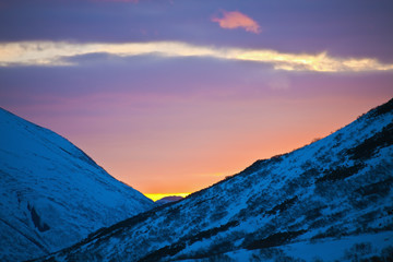 Sunset paints the evening sky in spring in the mountains of Kamchatka
