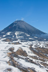 Fototapeta na wymiar The views of the working Karymsky volcano in may 2016 with a hel