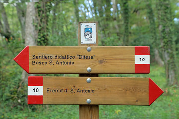 Close up of an isolated signboard along a trekking path. Direction indication. Arrow