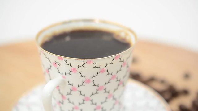 Coffee, coffee cup and grains.