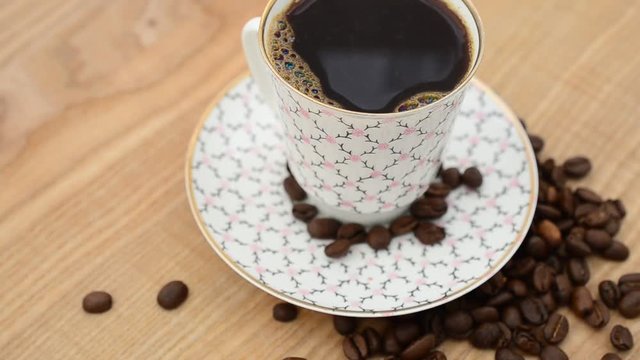 Coffee, coffee cup and grains.