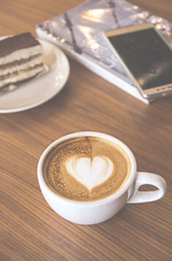 A cup of cafe latte and cake