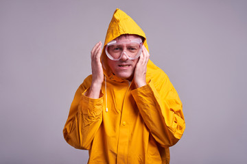 Man in yellow raincoat
