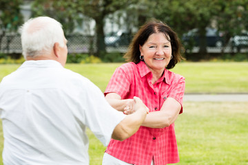 Couple Having Fun In Park
