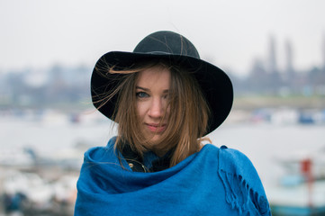 beautiful woman in warm clothing closeup portrait riverside