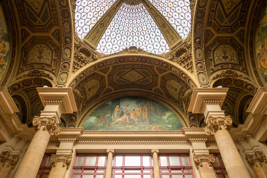 Inside the main post office in the old town of Barcelona. View to the fantastic roof with the stained-glass dome. The Edifici central de Correus i Telegrafs, an important cultural building in the city
