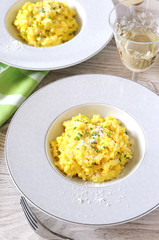 Risotto with saffron and glass of white wine