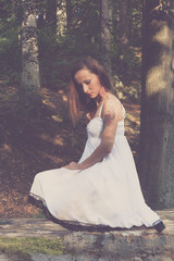 Fototapeta premium young thoughtful woman in the forest