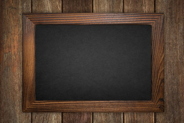 Fototapeta na wymiar blackboard on wood wall background