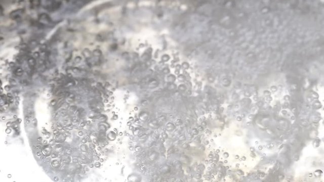 Closeup shot of Boiling water in a kitchen pot, Top view
