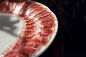 decorated arrangement of iberian cured ham on plate