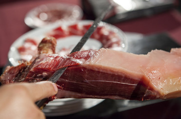 Master slicer cutting iberian cured ham