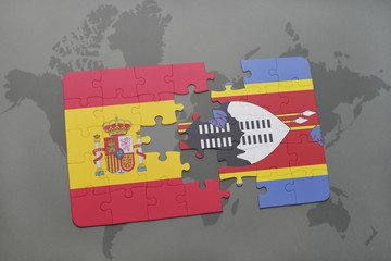 puzzle with the national flag of spain and swaziland on a world map background.
