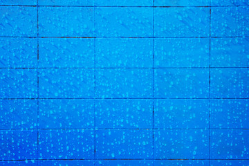 Blue concrete block wall seamless background and texture