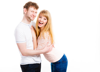 Happy enamoured couple hugging each other.