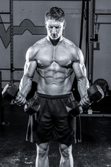 Fototapeta na wymiar Man working out in a gym
