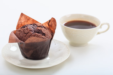 Cup of coffee and chocolate muffin