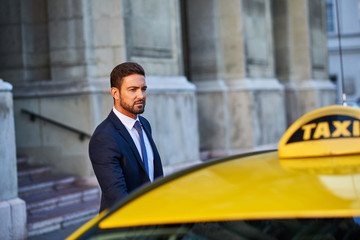 Young businessman with a taxi	