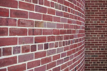 Curved and straight red brick wall background
