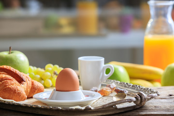 Breakfast with fresh fruits, egg and coffee