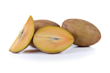 fresh sapodilla fruits on white background