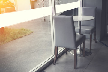 Cafe and luxury with sunny morning and two Chairs at the relax corner.