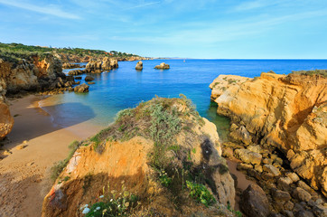 Fototapeta na wymiar Yellow cliffs on beach (Algarve, Portugal).