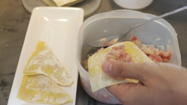 Homemade dumplings ready to casting in hot oil, stock video