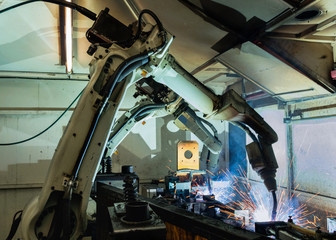 Team robot welding in automotive industrial