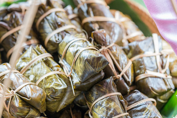 Sticky rice covered in banana leaf or 