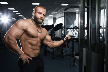 Fototapeta na wymiar Muscular athletic bodybuilder fitness model